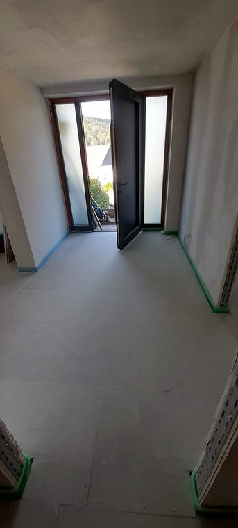 Eingangsbereich vor dem Verlegen der Bodenfliesen